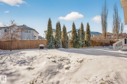 Snowy yard with a residential view - 