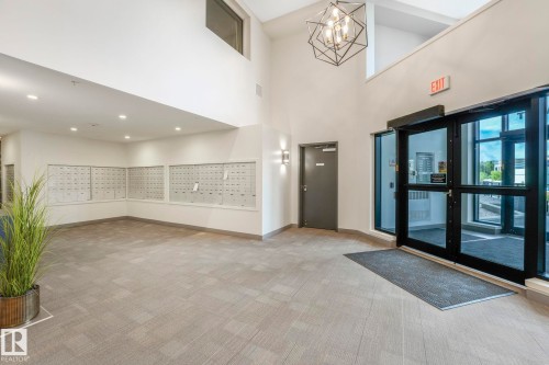Mailbox's are located here. - 814 200 Bellerose Drive, St. Albert, AB - Indoor Photo Showing Other Room