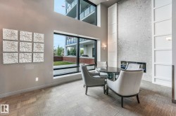 Enter main entrance and find little library, seating area and exercise room and social room nearby. - 