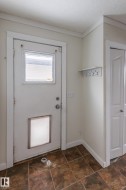 Doorway featuring baseboards - 