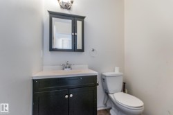 Bathroom featuring vanity and toilet - 