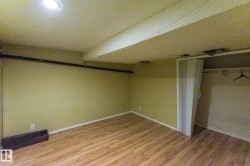 Unfurnished bedroom with light wood-style floors and a closet - 