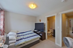 Bedroom featuring carpet floors and a textured ceiling - 