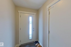 Foyer entrance featuring baseboards - 