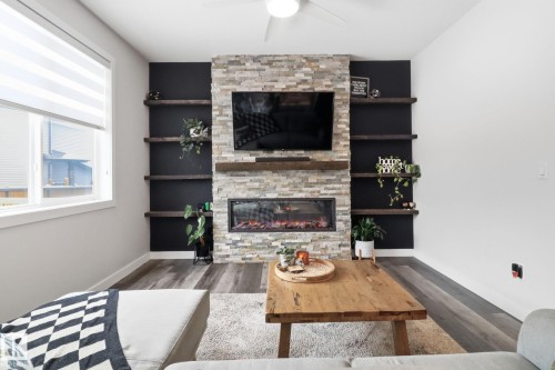5108 Lark Crescent Nw, Edmonton, AB - Indoor Photo Showing Living Room With Fireplace