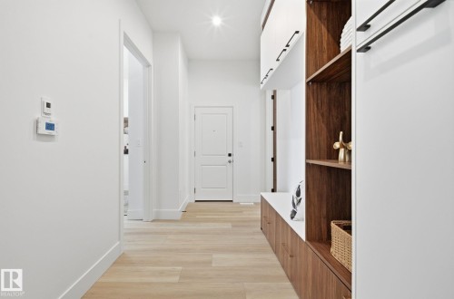 Mudroom featuring light wood finished floors and recessed lighting - 296 165 Avenue, Edmonton, AB - Indoor Photo Showing Other Room