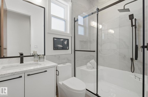 Bathroom featuring a marble finish shower and vanity - 296 165 Avenue, Edmonton, AB - Indoor Photo Showing Bathroom