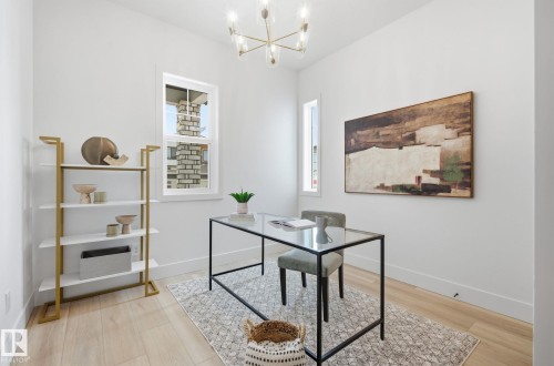 Office area featuring a chandelier and light wood-type flooring - 296 165 Avenue, Edmonton, AB - Indoor