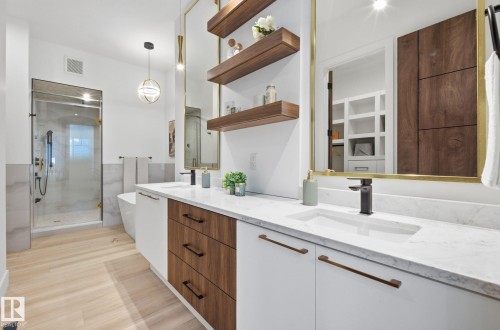 Full bath featuring double vanity, a shower stall, and a soaking tub - 296 165 Avenue, Edmonton, AB - Indoor Photo Showing Bathroom