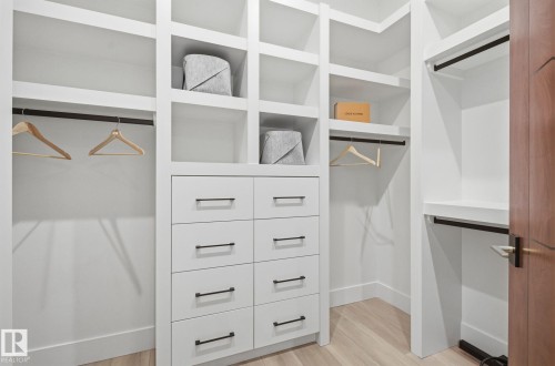 Walk in closet with light wood-style flooring - 296 165 Avenue, Edmonton, AB - Indoor With Storage