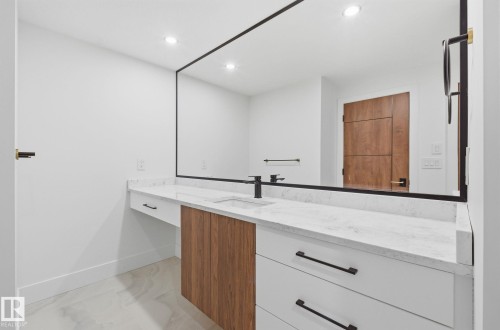 Bathroom featuring vanity, recessed lighting, and light marble finish flooring - 296 165 Avenue, Edmonton, AB - Indoor