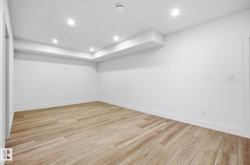 Basement featuring light wood-type flooring and recessed lighting - 296 165 Avenue, Edmonton, AB - Indoor Photo Showing Other Room