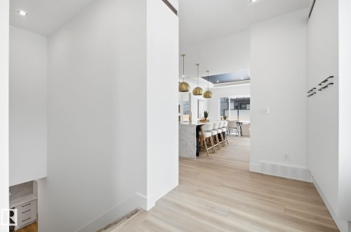 Hall featuring light wood-style flooring and recessed lighting - 296 165 Avenue, Edmonton, AB - Indoor Photo Showing Other Room