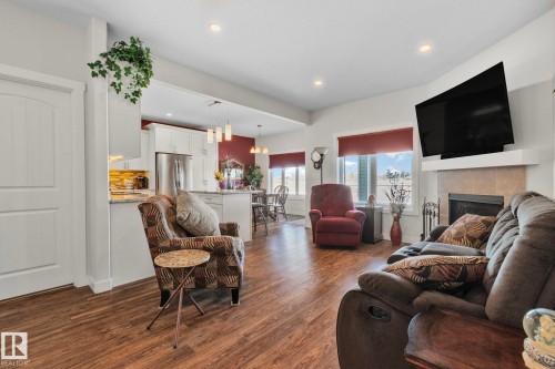 105 Houle Drive, Morinville, AB - Indoor Photo Showing Living Room With Fireplace