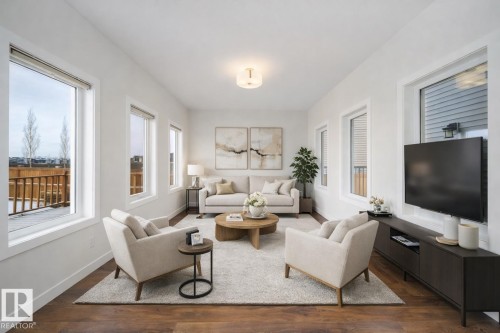 Living area with dark wood-type flooring - 19743 26 Avenue, Edmonton, AB - Indoor Photo Showing Living Room