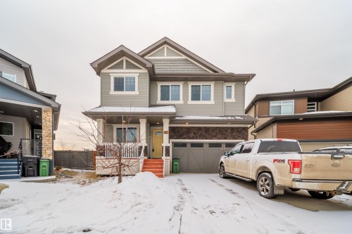 View of front facade with a garage and driveway - 19743 26 Avenue, Edmonton, AB - Outdoor With Facade