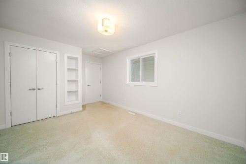 Unfurnished bedroom with carpet floors and a closet - 19743 26 Avenue, Edmonton, AB - Indoor Photo Showing Other Room