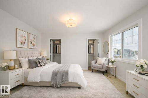 Bedroom with carpet flooring and connected bathroom - 19743 26 Avenue, Edmonton, AB - Indoor Photo Showing Bedroom