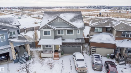 View of front of home featuring an attached garage and a residential view - 19743 26 Avenue, Edmonton, AB - Outdoor With Facade