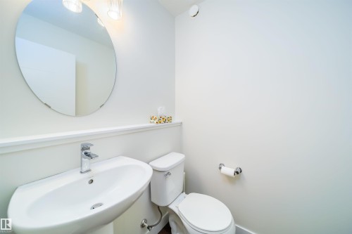 Half bathroom featuring a sink and toilet - 19743 26 Avenue, Edmonton, AB - Indoor Photo Showing Bathroom
