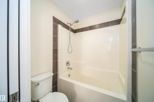 Bathroom with shower / tub combination and toilet - 19743 26 Avenue, Edmonton, AB - Indoor Photo Showing Bathroom