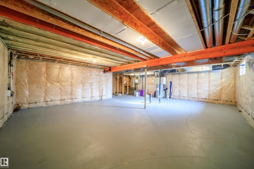 Unfinished below grade area featuring heating unit - 19743 26 Avenue, Edmonton, AB - Indoor Photo Showing Basement