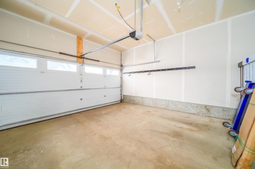 Garage featuring a garage door opener - 19743 26 Avenue, Edmonton, AB - Indoor Photo Showing Garage