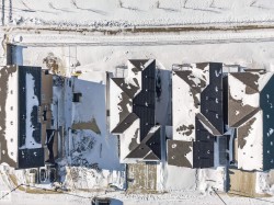 Snowy aerial view featuring a residential view - 