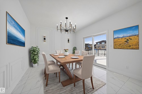 Dining area featuring hanging lights and light marble finish floors - 4006 40 Street, Beaumont, AB - Indoor Photo Showing Dining Room