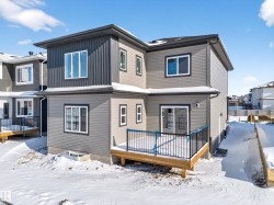 Snow covered house featuring a deck - 
