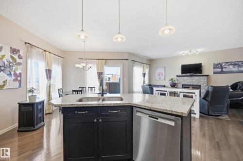40 Becker Crescent, Fort Saskatchewan, AB - Indoor Photo Showing Kitchen With Fireplace With Double Sink