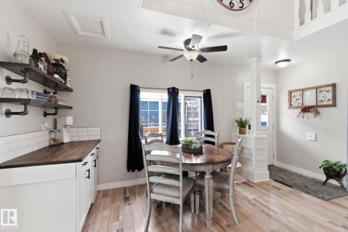 Dining area with light wood-type flooring and a ceiling fan - 4919 50 Avenue, Bon Accord, AB - Indoor Photo Showing Dining Room