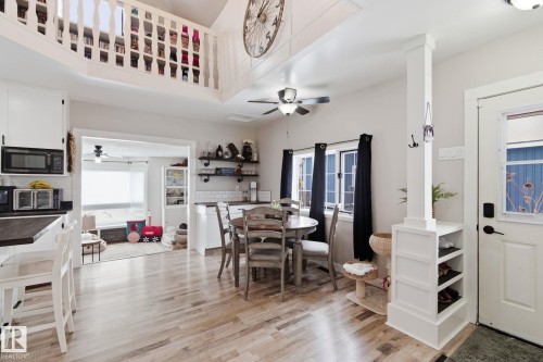 Dining area with a ceiling fan and light wood-type flooring - 4919 50 Avenue, Bon Accord, AB - Indoor Photo Showing Dining Room