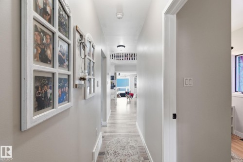 Corridor featuring baseboards and light wood-style flooring - 4919 50 Avenue, Bon Accord, AB - Indoor Photo Showing Other Room