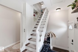 Staircase with baseboards and wood finished floors - 