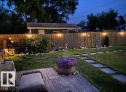 The yard is a beautiful place to enjoy warm summer evenings. - 