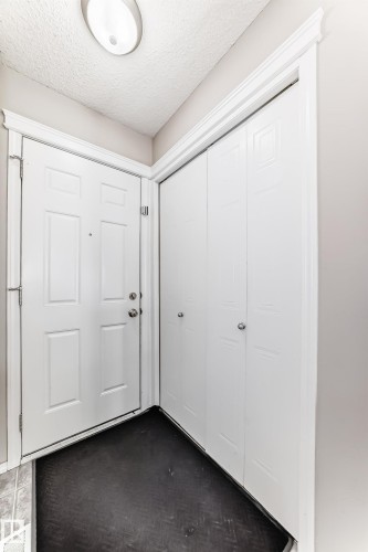 Foyer entrance featuring a textured ceiling - 14043 151 Avenue, Edmonton, AB - Indoor Photo Showing Other Room