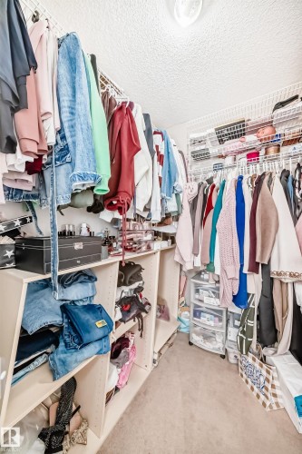 Walk in closet featuring light carpet - 14043 151 Avenue, Edmonton, AB - Indoor With Storage