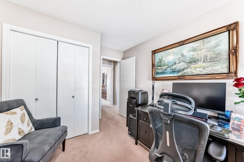 Office area featuring light colored carpet and a textured ceiling - 14043 151 Avenue, Edmonton, AB - Indoor Photo Showing Office