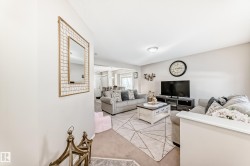 Living area with light carpet - 