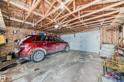 Garage featuring a garage door opener - 