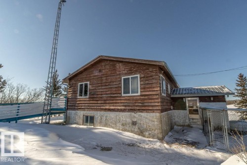 View of snow covered exterior featuring a gate - 11126 Twp Rd 605A, Rural St. Paul County, AB - Outdoor