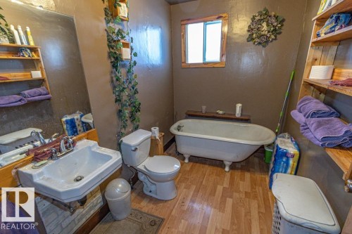Full bath with a freestanding bath and light wood finished floors - 11126 Twp Rd 605A, Rural St. Paul County, AB - Indoor Photo Showing Bathroom