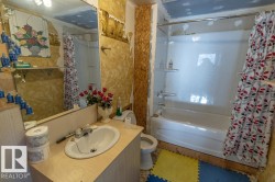 Full bath featuring vanity and shower / bath combination with curtain - 
