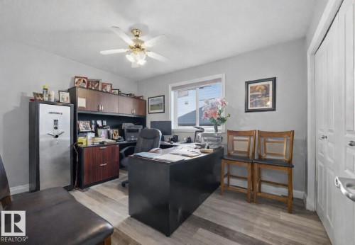 Home office featuring light wood-style floors and a ceiling fan - 3011 44A Street, Edmonton, AB - Indoor Photo Showing Office