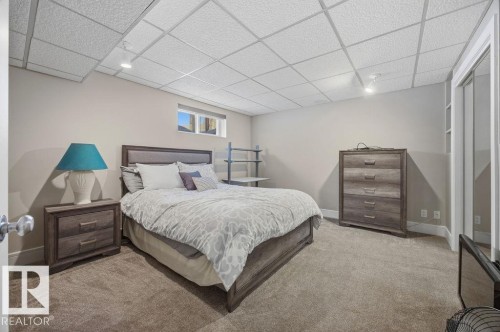 Bedroom with a drop ceiling, carpet, and track lighting - 3011 44A Street, Edmonton, AB - Indoor Photo Showing Bedroom