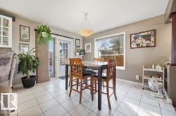 Dining room featuring light tile patterned floors - 