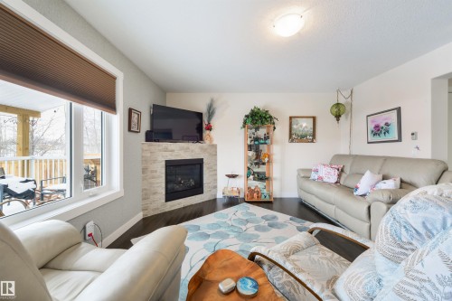 4914 47 Street, Redwater, AB - Indoor Photo Showing Living Room With Fireplace