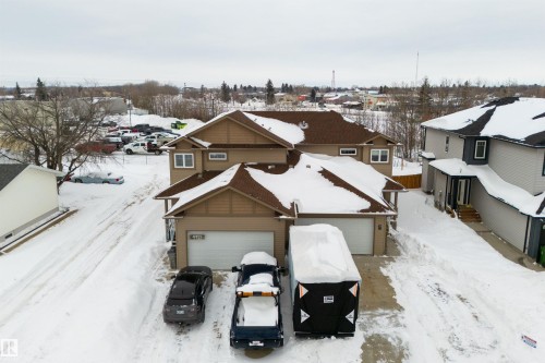 Snowy aerial view with a residential view - 4914 47 Street, Redwater, AB - Outdoor