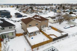 Snowy aerial view with a residential view - 